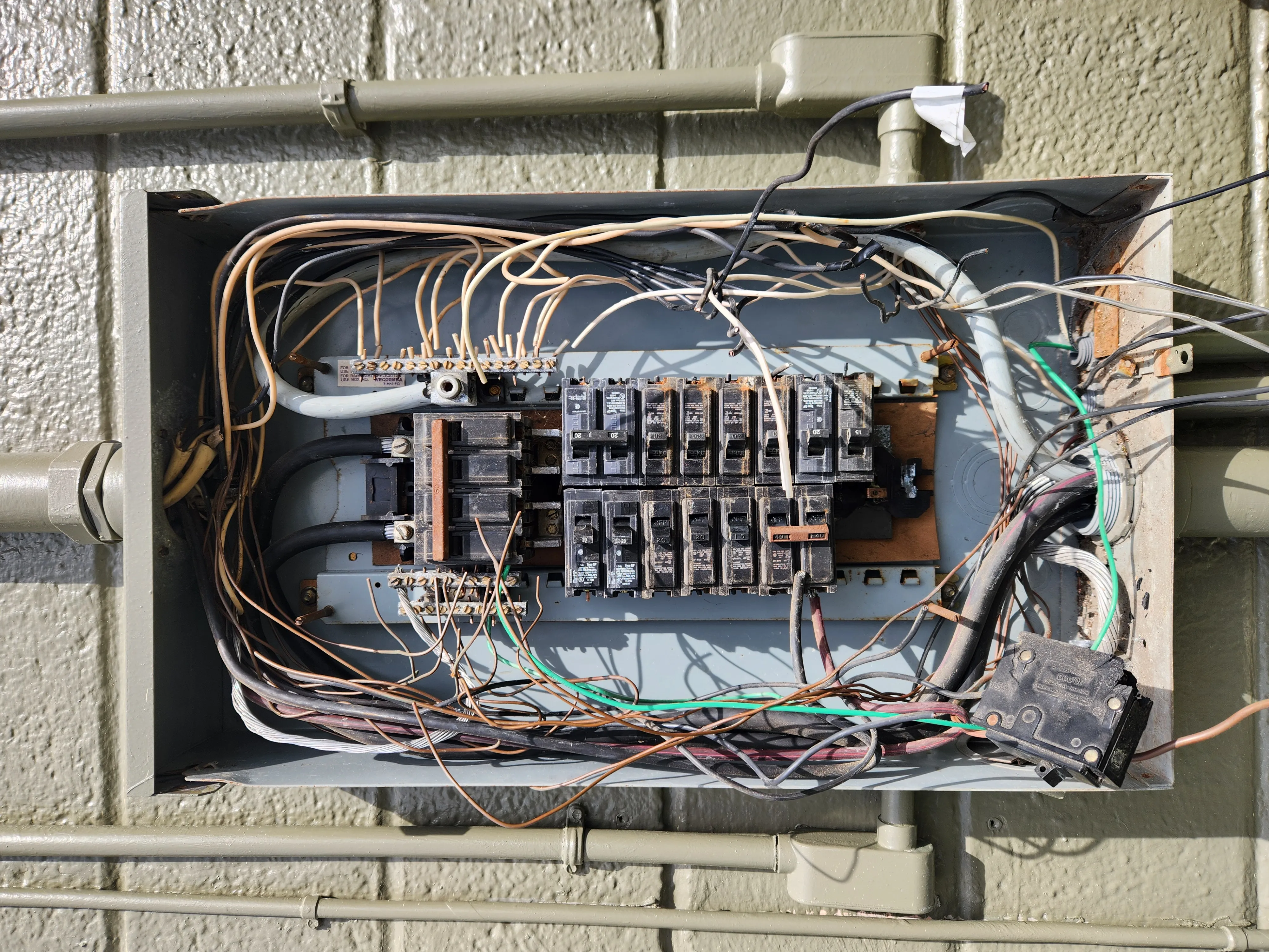Older electrical panel and wiring conditions reviewed during a Wilmington remodel.