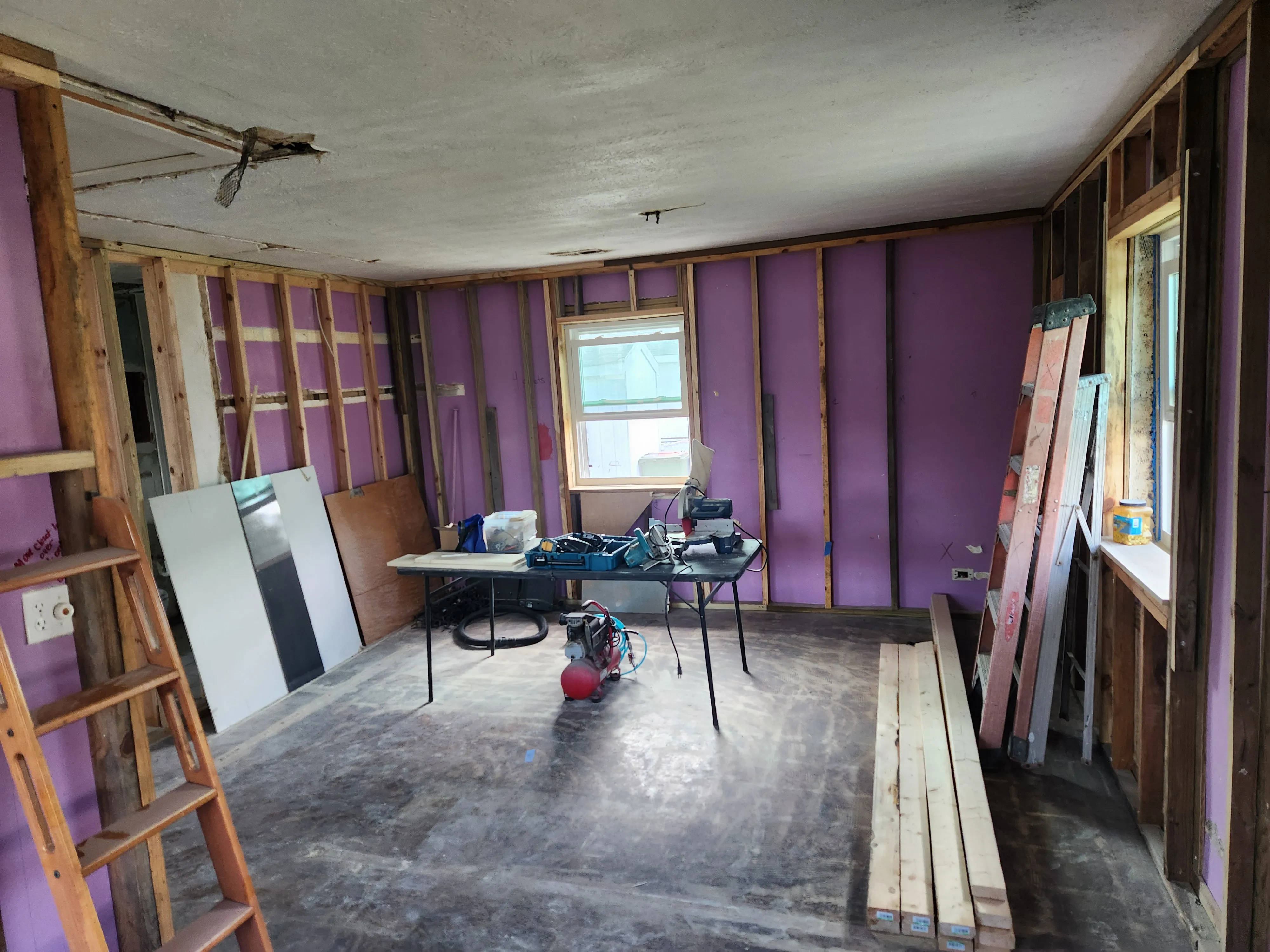 Interior remodel framing in a historic Wilmington home prepared for electrical rewiring.