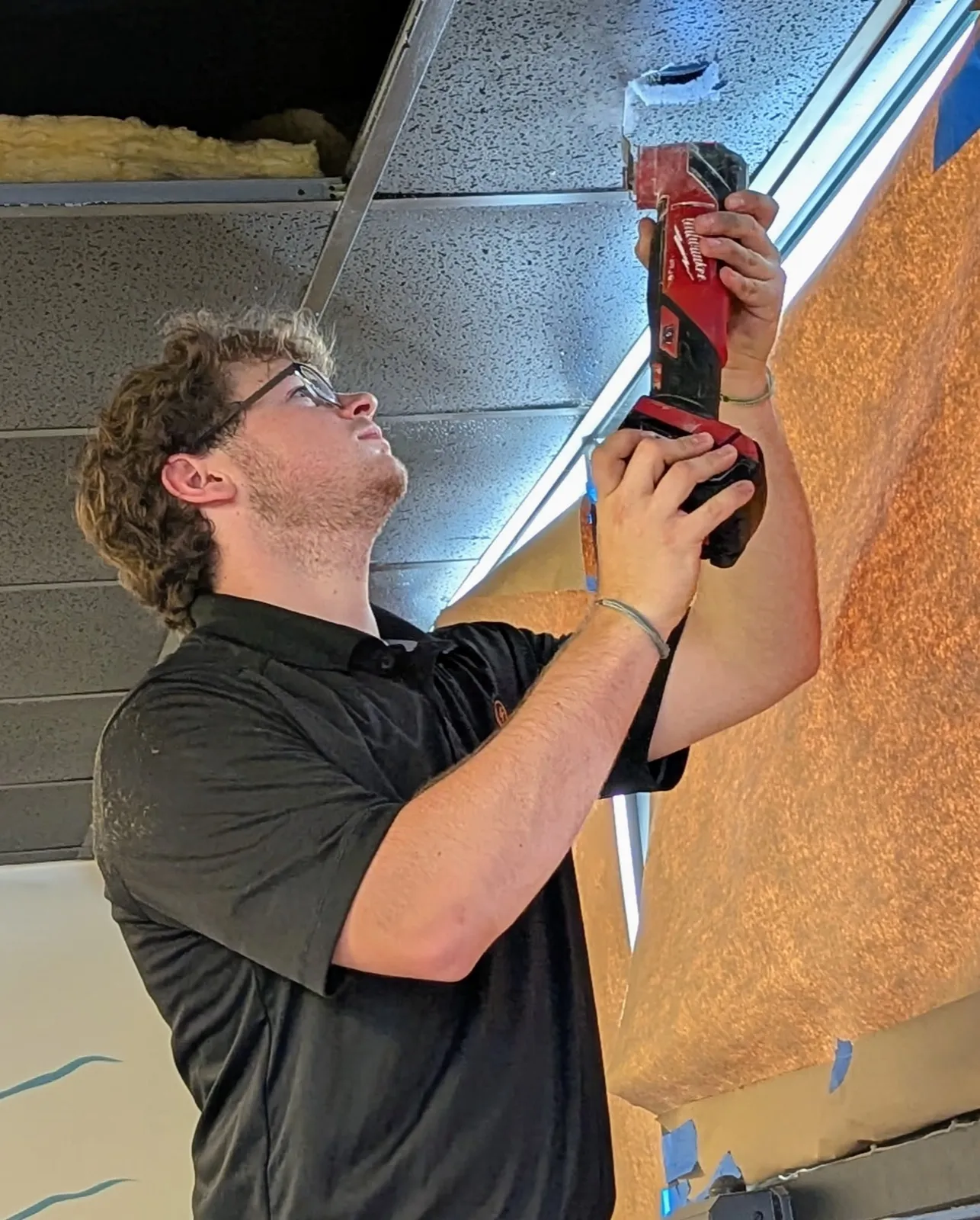 Coastal Comfort Electric technician working on a residential electrical installation.