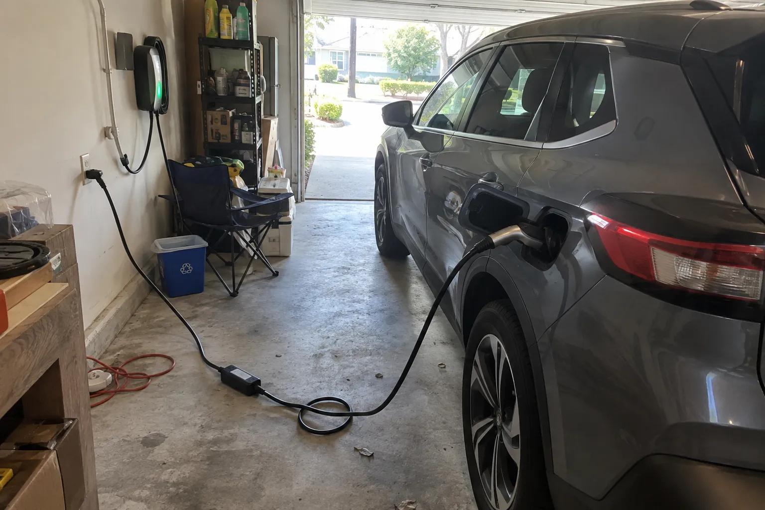 Level 1 vs. Level 2 Home EV Charging: Which Is Right for Your Wilmington Home? An electric vehicle charging inside a lived-in home garage.