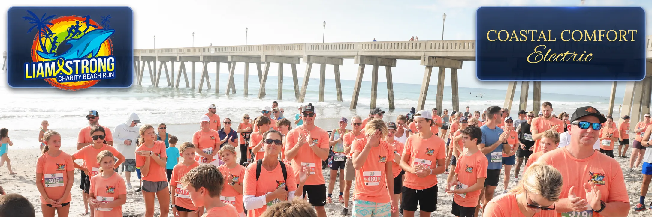A previous Liam Strong Charity Beach Run at Wrightsville Beach beneath Johnnie Mercers Pier, with the official race logo at upper left and the Coastal Comfort Electric logo at upper right.