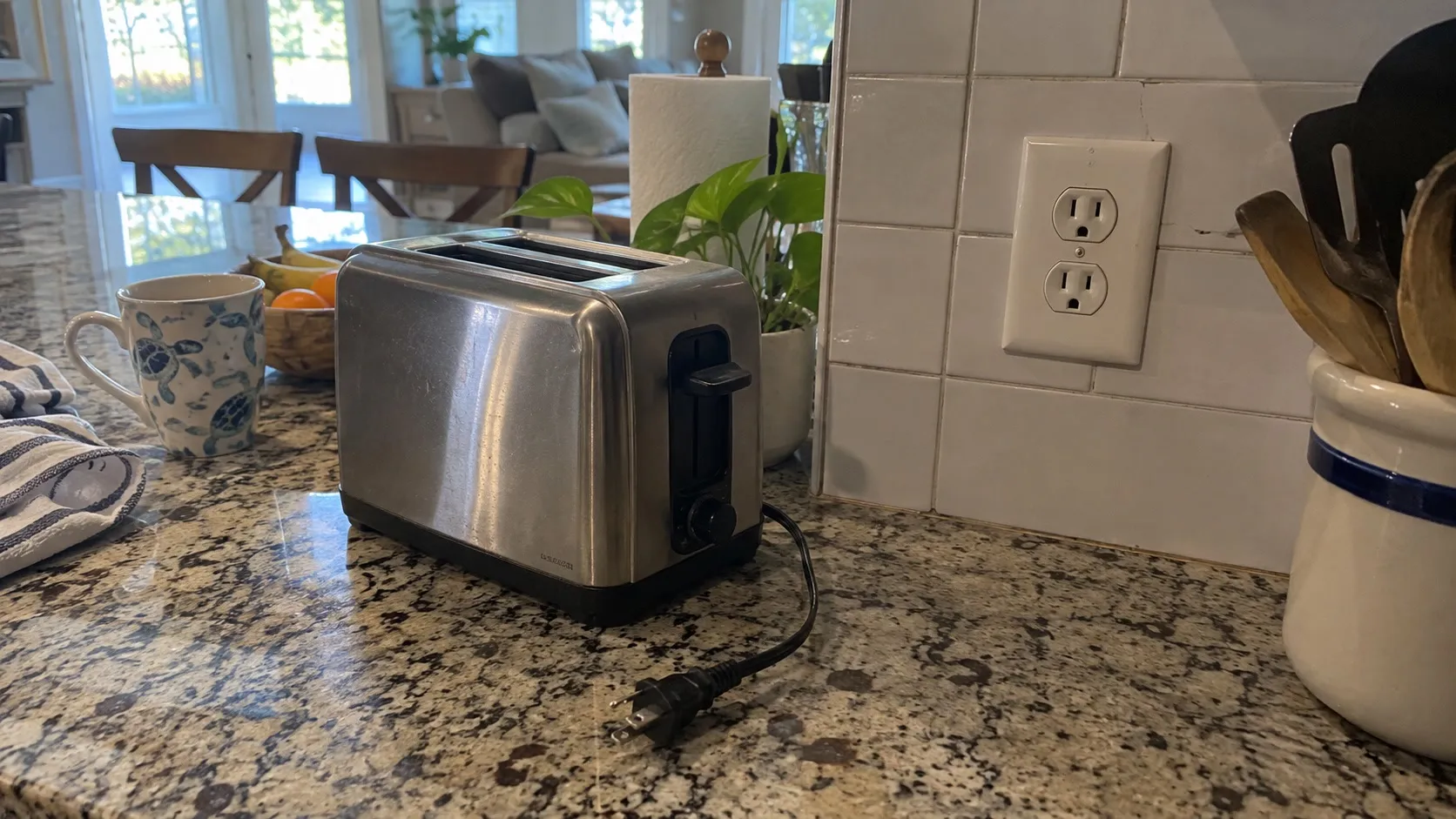 Kitchen outlet and unplugged appliance in a home.